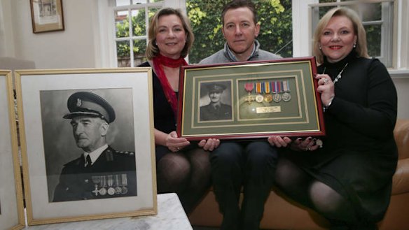 Opening engagement: Carolyn Smiyth, John Purdue and Louise Nicol with a portrait of their grandfather Colonel John Purdue.