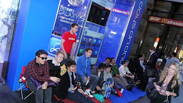 People waiting outside Samsung's store on Monday.