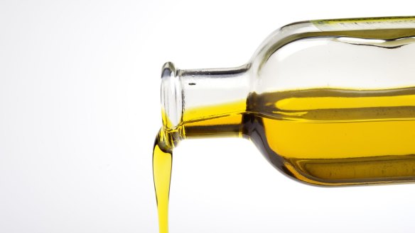 Olive Oil from a bottle Olive oil pouring from a bottle. iStock image downloaded under the Good Food team account (contact syndication for reuse permissions).