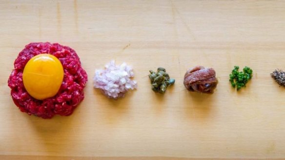 Steak tartare and accompanying ingredients.