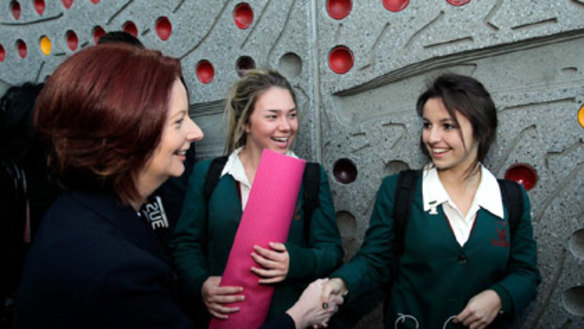 Julia Gillard chats with schoolgirls in Parramatta in western Sydney this morning.