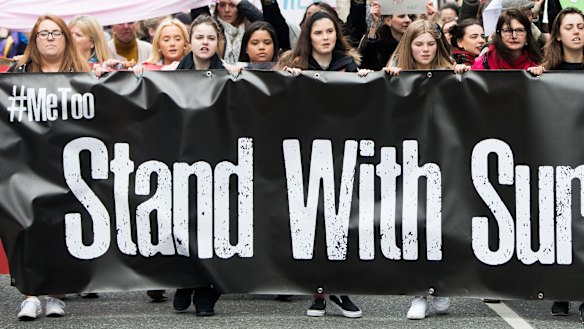 People take part in a protest in Dublin, in support of the woman at the centre of a rape trial after two Ireland ruby players were acquitted. 
