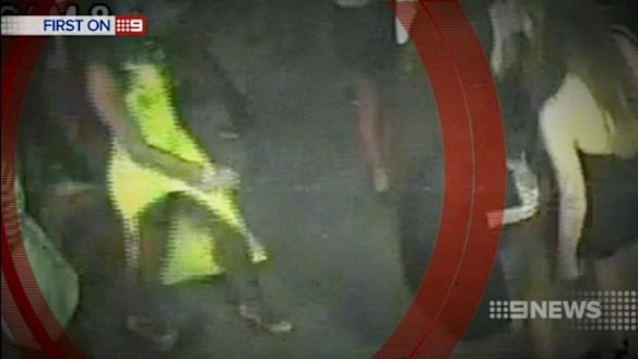 The female patron is seen walking across the room.