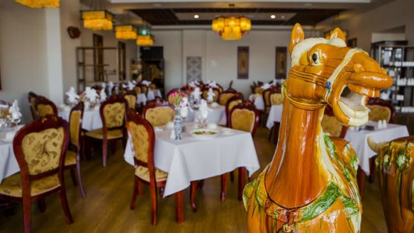 Glazed horses command the centre of the dining room at Tang Dynasty.