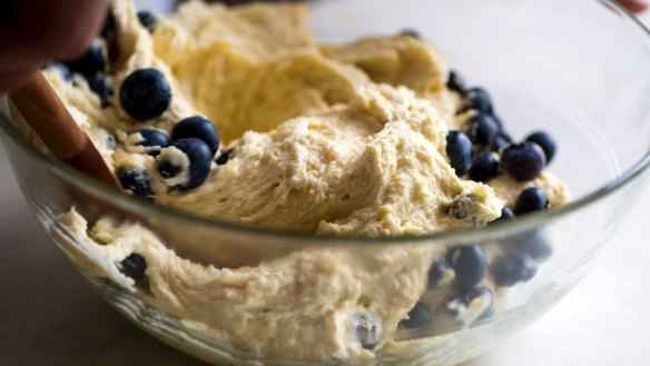 Mixing the batter and blueberries – be sure to save some berries for the top of the cake.