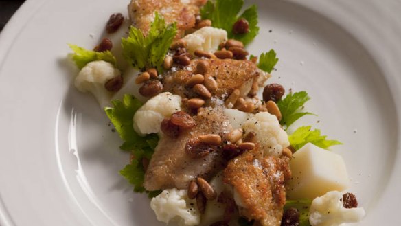 Confit chicken wings with cauliflower, sultanas and pine nuts.