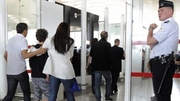 Distraught relatives and friends of passengers of Air France flight AF447 arrive at a crisis centre at Charles de Gaulle Airport near Paris.