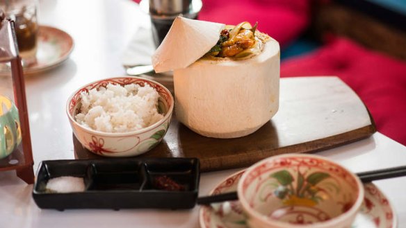 Prawn curry served in a coconut.