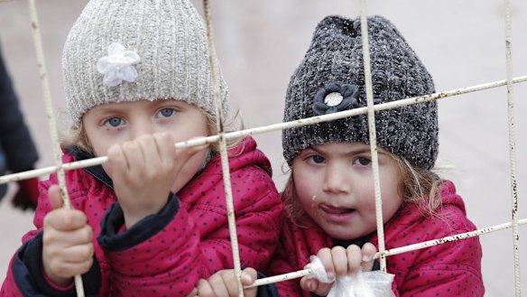 Syrian children wait to return to their homeland at the Turkish border crossing with Syria in Kilis, Turkey, this week. 