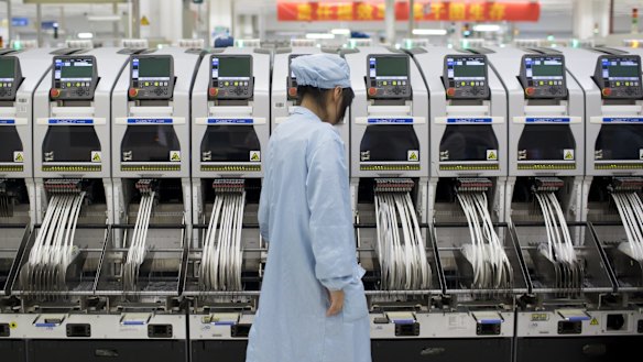 A ZTE employee at its factory in Shenzhen.