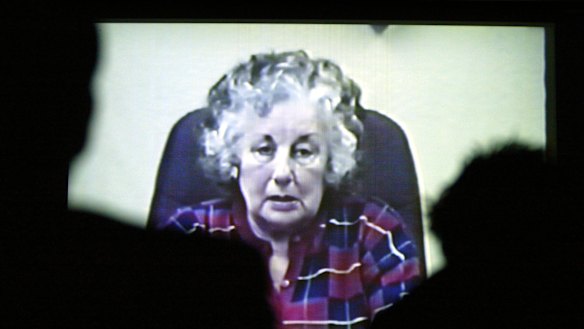 Ruth speaks to reporters in 2003.