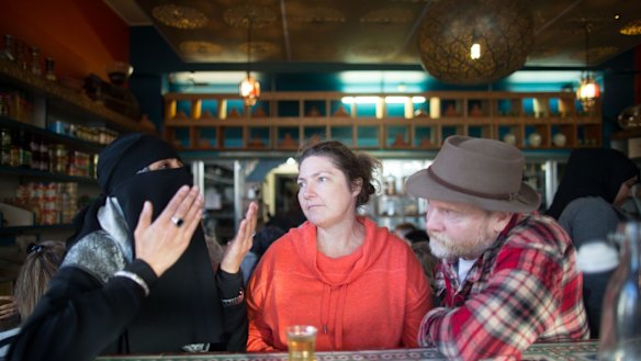 A Muslim woman in niqab speaks to non-Muslims at a "speed-dating" event in Brunswick, Melbourne. 