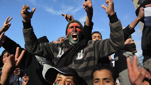 Rage  ... demonstrators demand the removal of the Libyan leader, Muammar Gaddafi, on Thursday. The east of the country has largely fallen  under opposition control.