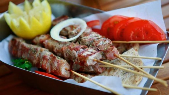 Excellent smoky pork skewers are hot off the grill.