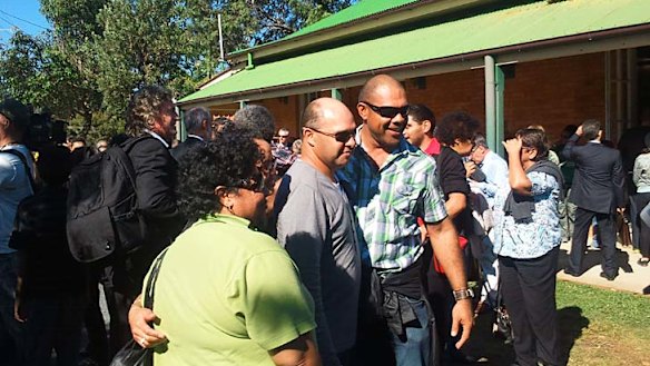 The Quandamooka people celebrate after the Federal Court's decision at a hall at Dunwich, North Stradbroke Island.