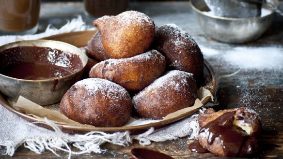 Orange and ricotta doughnuts and chocolate dipping sauce.