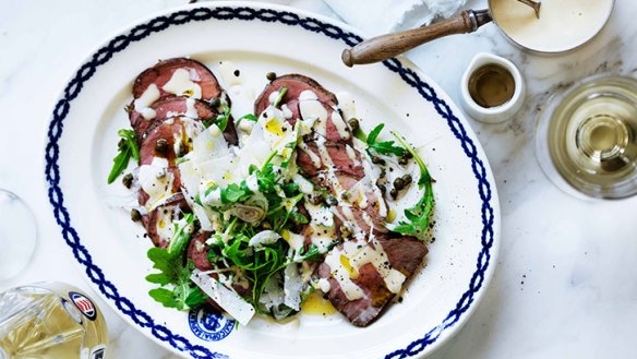 Rare roast beef salad with dressing makes a great lunch.