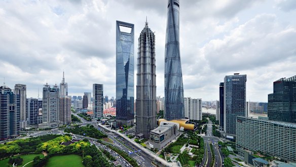 The Shanghai skyline features dramatic skyscrapers.
