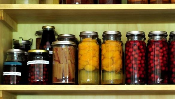 Cupboard of preserves -sour cherries, apricots and rhubarb.