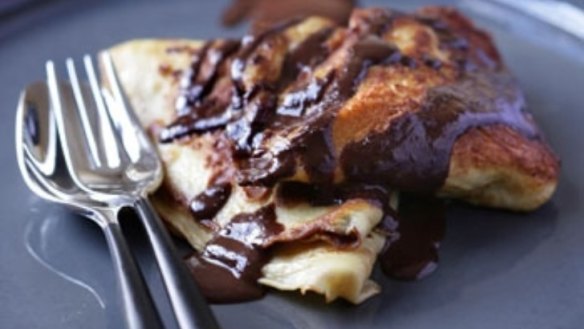 Walnut filled pancakes with chocolate sauce