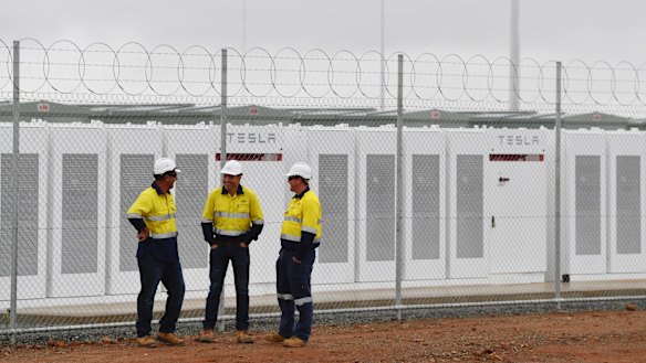 Construction workers at the launch of Tesla's 100 megawatt lithium-ion battery at Jamestown, north of Adelaide. 