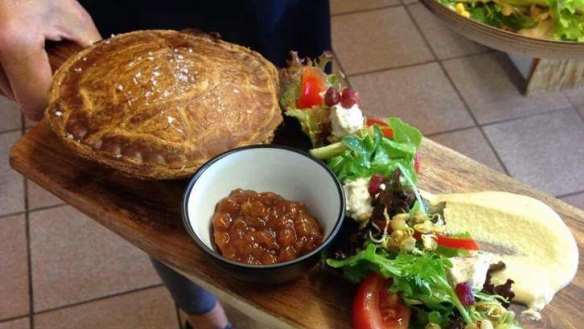 Plant-based pie served with chutney and salad.