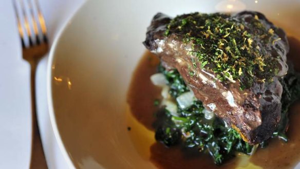 Braised beef cheeks with bitter greens and gremolata.
