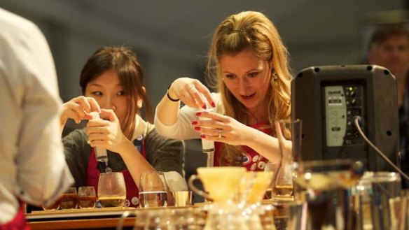Judges Kammie Hui and Petra Vesela at the World Barista Championships in Melbourne on Sunday.