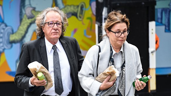 Geoffrey Rush and wife Jane Menelaus outside the Federal Court in Sydney on Wednesday.