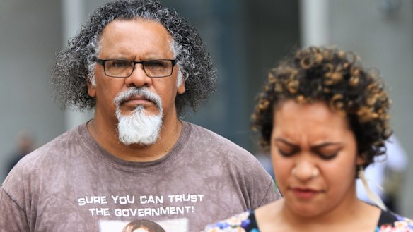 Wangan and Jagalingou traditional owner and council spokesperson Adrian Burragubba and his niece, Murrawah Johnson, speak outside the Brisbane Supreme Court in December after launching another challenge to the Adani Carmichael mine.