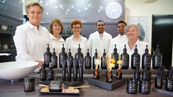 Celestine Hade with the team at their Australian manufacturing plant.