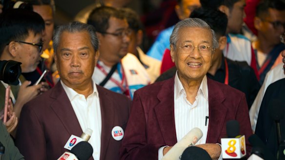 Mahathir Mohamad, right, speaks to media at a hotel in Kuala Lumpur, Malaysia, Wednesday.