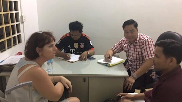 Australian nurse Tammy Davis-Charles is questioned by Cambodian police in November of last year.