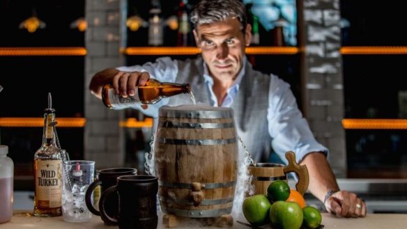 Grant Collins of Powder Keg on Kellet Street in Potts Point, makes the signature punch, served in a powder keg and aptly named "The Powder Keg".