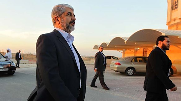 Man on a mission … Khalid Mishal with his security detail in Doha, Qatar. As the winds of change sweep through the region the Hamas leader has an opening through which he can become a leader for all Palestinians.