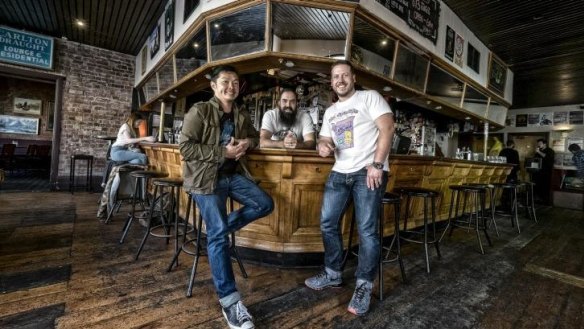 Front from left, Huxtaburger founders Jeff Wong and Daniel Wilson brought American-style burgers to Australia.