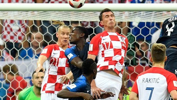 Croatia's Mario Mandzukic scores at the wrong end.