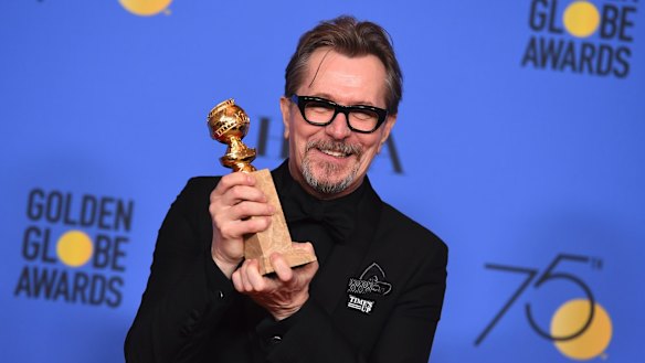 Gary Oldman poses in the press room with the award for best performance by an actor in a motion picture - drama for Darkest Hour.