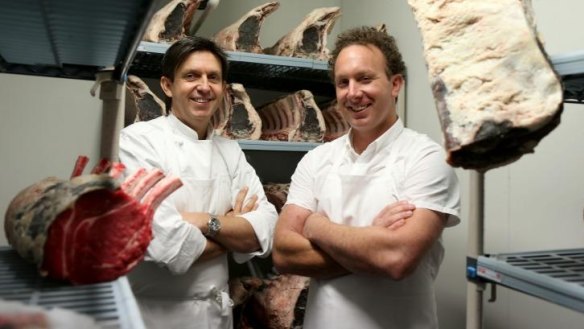 Chef Andrew McConnell (left) and butcher Troy Wheeler in the meat ageing room at the Builders Arms Hotel.