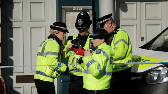 Police officers stand outside a Zizzi restaurant in Salisbury in March.