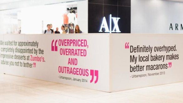 ''Overpriced, overrated and outrageous'' ... Hoardings at Adriano Zumbo's in-progress kiosk in Melbourne's Emporium.