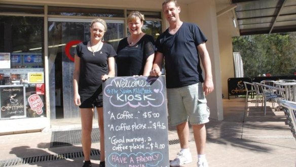 Head chef Megan Jones and owners Kylie Pickett and Kev Chilver with the sign.