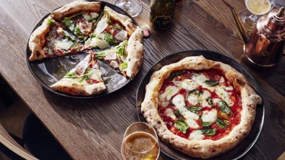 Prosciutto and margherita pizzas from the wood-fired oven at Assembly.