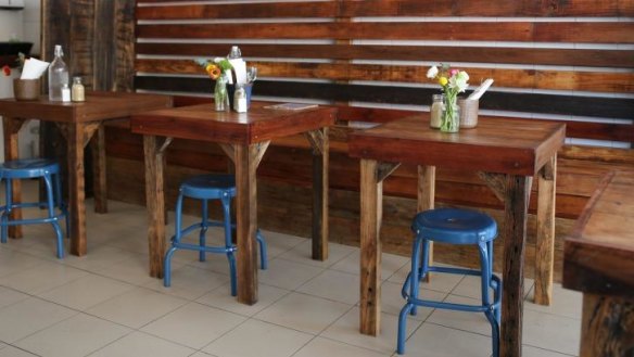 White tiles and simple dark wood tables work well.