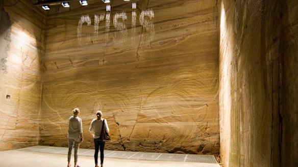 MONA visitors read the water words in Julius Popp's bit.fall.