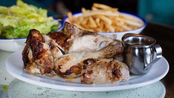 Roast chicken with fries, green salad and gravy.