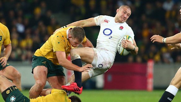 Wrapped up: Mike Brown is tackled at AAMI Park.