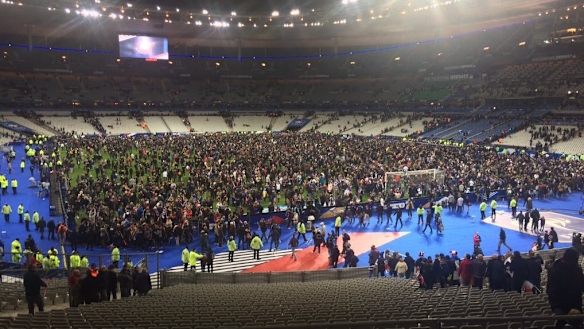 Many fans remained inside the ground and were allowed onto the pitch. 