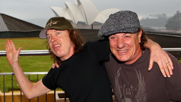 Angus Young on tour with Brian Johnson and AC/DC in happier times.