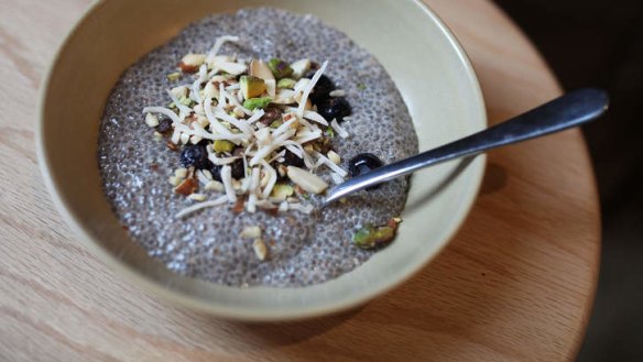 Chia pudding topped with shredded coconut and nuts.
